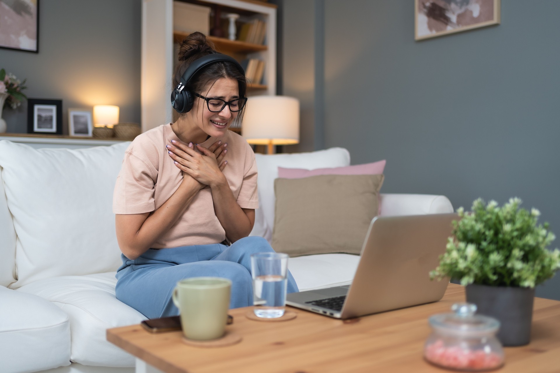 Emotional support. Young woman after relationship breakup sharing in a Grove on laptop computer with Sage Community